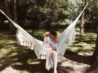 mom and baby in macrame hammock