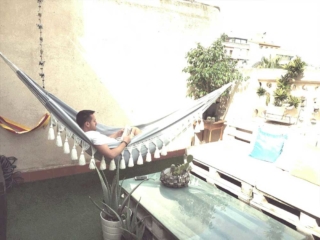 white indoor hammock in patio